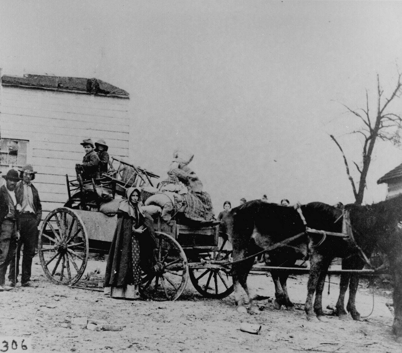 Photo of a refugee family leaving a war area with belongings loaded on a cart, National Archives and Records Administration Civil War Photos, 200-CC-306